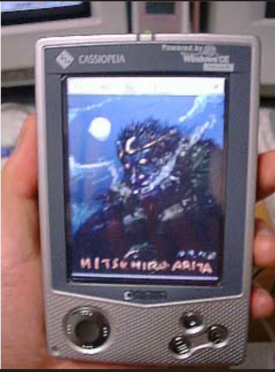 CASIO handheld displaying Mitsuhiro Arita artwork